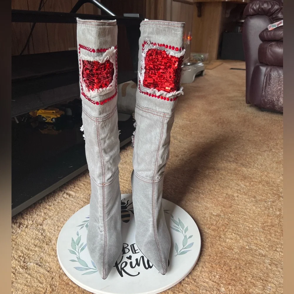 Woman’s multi-color red stone denim pointy toe knee-high boots.